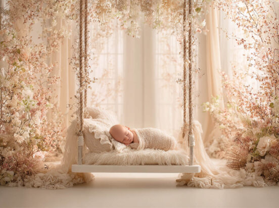 Newborn baby posed in a cosy floral nest, Melbourne newborn and maternity photography