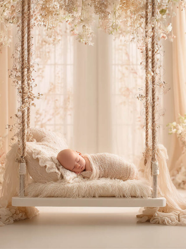 Newborn baby posed in a cosy floral nest, Melbourne newborn and maternity photography