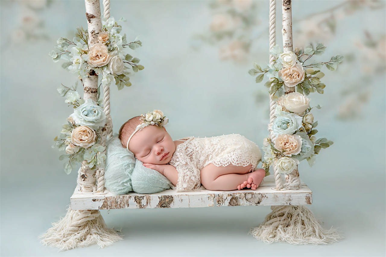 Newborn baby resting on a hand-painted backdrop, Melbourne newborn & baby studio