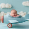 Peaceful newborn with a delicate flower headband, Melbourne newborn & baby studio