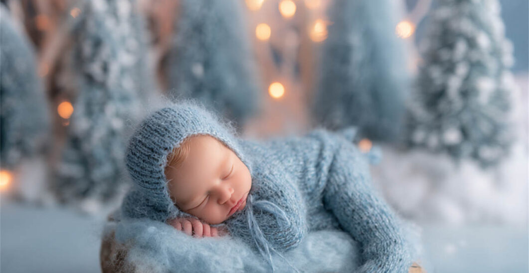Newborn baby resting on a hand-painted backdrop, Melbourne newborn photography