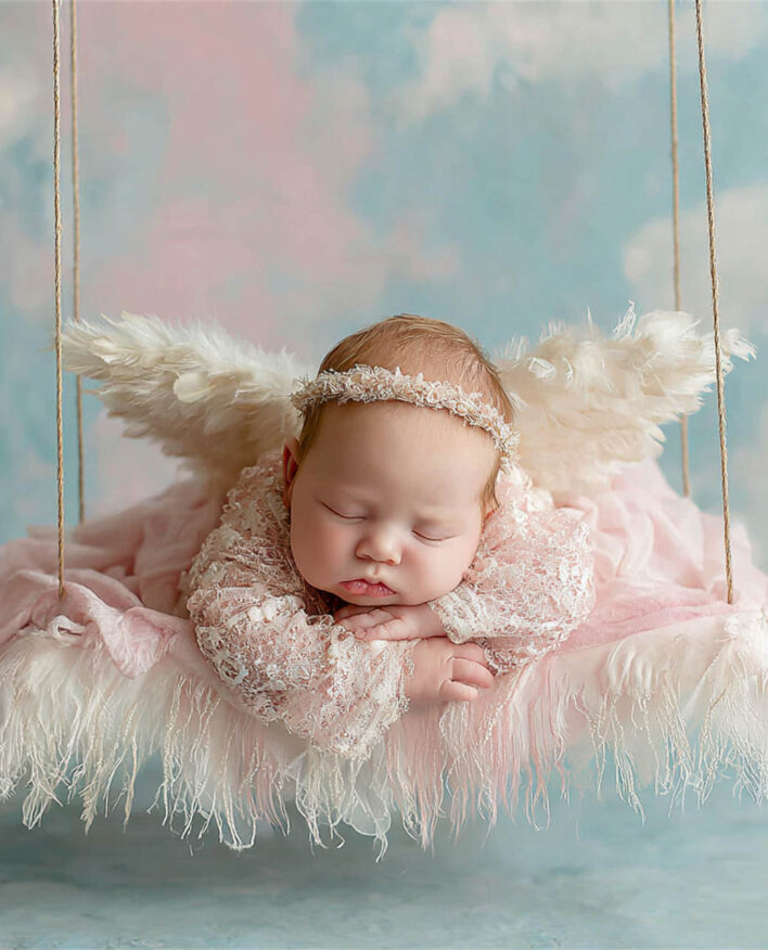 Peaceful newborn with a delicate flower headband, newborn photography Melbourne