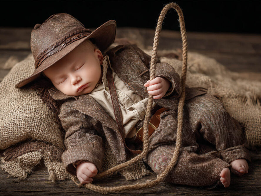 Newborn cradled in soft fur and florals, Melbourne newborn photography