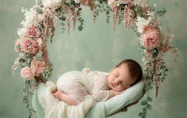 Newborn baby posed in a cosy floral nest, Melbourne newborn & baby studio