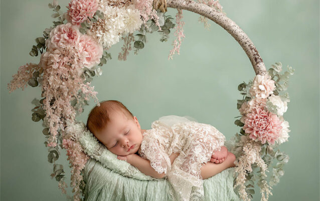 Peaceful newborn with a delicate flower headband, Melbourne newborn and maternity photography