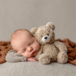 Gently posed newborn on a textured backdrop, Melbourne newborn & baby studio