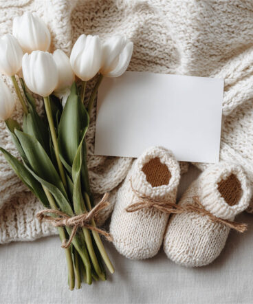Newborn baby posed in a cosy floral nest, Melbourne newborn & baby studio